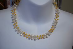 "Handcrafted wire necklace with baroque white freshwater pearls and yellow cat's eye quartz beads. The necklace is in pristine condition. Measures 18 inches long The pearls are similar in size and shape, around 1/4\" diameter The quartz beads are 1/8\" diameter New Hampshire jewelry maker: NURIT NISKALA Wedding necklace or bridesmaid" Handmade Yellow Pearl Necklaces, Yellow Beaded Pearl Necklace, Yellow Beaded Pearl Necklace As Gift, Yellow Beaded Pearl Necklace Gift, Handmade Yellow Pearl Necklace For Gift, Yellow Cats, Crystal Bead Necklace, Yellow Cat, Wire Necklace