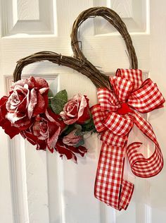 She's a beauty! This wreath is a grapevine heart decorated with frosty red roses and perfect for your door or wall.  Use it as a Valentine decoration or in a little girl's room, or in a room as an accent.    My wreaths make great gifts! If you wish to purchase this wreath as a gift, please let me know what personal message you'd like to include.  My wreaths are one-of-a-kind. No two wreaths are exactly the same so if there is something that you love, get it before it's gone. "Favorite My Shop" so you will see all my new wreaths listed in your Etsy news feed and I will be listed in your favorites for quick and easy access for your browsing convenience!   Check out the other wreaths we have available! https://www.etsy.com/shop/KPWreathsandthat Follow us on Facebook!  https://www.facebook.com Door Decor Wedding, Red Rose Wreath, Valentine Decoration, Valentine Decor, Rose Wreath, Heart Wreath, Valentine Wreath, Door Wreath Hanger, Front Door Decor