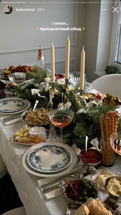 a table is set with food and candles