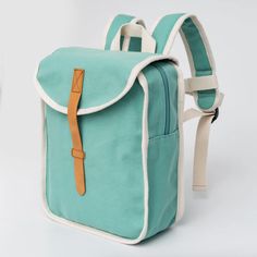 A light green kids backpack made or recycled cotton with natural coloredbinding and PU fake leather accents. The backpack closes with a zipper, theFlap has a hidden magnet for closing and fake leather front closing and zipperpullers.Adjustable shoulder straps and safety belt at front which can be removed.A perfect sized backpack for primary school and for traveling. Damp clothcleaning only.For children up to 4-8 yrs Eco Backpack, Maileg Dolls, Cotton Backpack, Bags To Sew, Party Stationery, Childrens Backpacks, Safety Belt, Dollhouse Accessories, Kids Backpacks