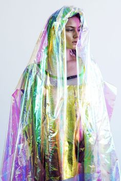 a woman in a colorful plastic raincoat