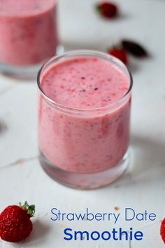 strawberry date smoothie in a glass with strawberries on the side and text overlay