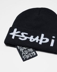 The 1999 Beanie Black/White is a black wool blend beanie. This style features an internal signature Ksubi tag and a white jacquard 1999 Ksubi logo on front. Streetwear Beanie With Letter Print, Winter Streetwear Hats With Letter Print, Hip Hop Beanie For Streetwear In Winter, Hip Hop Beanie For Winter Streetwear, Winter Streetwear Beanie With Letter Print, Letter Print Beanie For Streetwear, White Letter Print Hats For Winter, White Winter Hats With Letter Print, White Letter Print Winter Hats