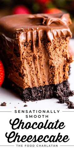 a slice of chocolate cheesecake on a white plate with strawberries in the background