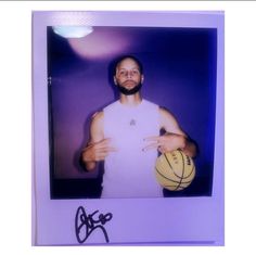 a man holding a basketball in his right hand