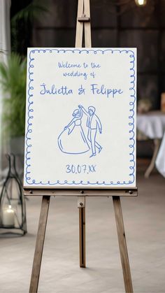 an easel with a sign on it that says welcome to the bride and groom