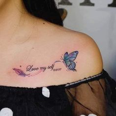 a woman with a butterfly tattoo on her shoulder and the words, love my self