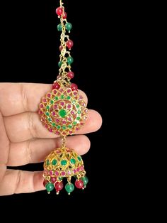 gold plated earrings color of stone - green and ruby pink type of stone - cz Polki pearls / beads - quartz beads plating - gold plated length in inches - 2.8 inches width in inches - 1 inches Ear post - straight Festive Jeweled Jhumkas Gift, Festive Jeweled Jhumkas For Gift, Festive Jeweled Jhumkas Perfect For Gifts, Festive Jeweled Dangle Jewelry, Gold Jeweled Jhumkas As Gift, Gold Kundan Earrings, Jeweled Jhumkas For Diwali Gift, Jeweled Danglers For Festivals Gift, Jeweled Danglers For Festivals And Gifts