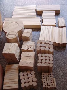 several pieces of wood are laid out on the floor with circles and squares around them