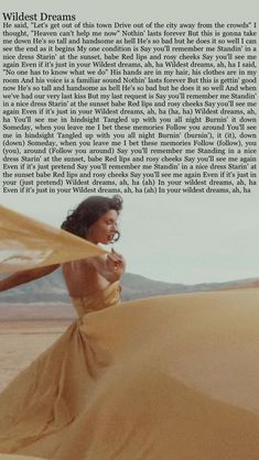 a woman in a long dress standing on top of a sand dune