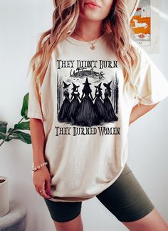 They Didn't Burn Witches They Burned Women Sweatshirt, Spooky Witch Crewneck, Halloween Witchy T-Shirt, Halloween Feminism Shirt *HOW TO ORDER* 1. Select the shirt 𝗦𝘁𝘆𝗹𝗲 2. Select the 𝗦𝗶𝘇𝗲 3. Select the shirt color 4. Select the quantity, 5. Click 𝗔𝗗𝗗 𝗧𝗢 𝗖𝗔𝗥𝗧. If you want to buy more than one, please go back to the listing and repeat the steps. "If you have any question, please send us a message." *BRAND* If you want a specific brand, please send us a message right after you pl Halloween Fairy Grunge T-shirt With Crew Neck, Witch Shirts For Women, Witchy Woman Shirt, Fall Witchy Graphic Print T-shirt, Witchy Cotton T-shirt For Fall, Sweater Drying Rack, Feminism Shirt, Witch Girl, Spooky Witch