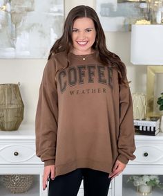 Introducing our Coffee Weather Sweatshirt, the perfect cozy companion for embracing those crisp and chilly days. Whether you're heading to your favorite coffee shop, enjoying a leisurely stroll in the park, or simply lounging at home with a warm cup of java, this sweatshirt celebrates your love for both comfort and caffeine.
The words "coffee weather" are elegantly displayed in black on an army brown sweatshirt. Available in sizes ranging from S to 5XL, our sweatshirt ensures a comfortable and relaxed fit for everyone.
Embrace the essence of fall and winter with the inviting warmth of your go-to coffee and the cozy comfort of our sweatshirt. The soft fabric and casual silhouette make it an ideal addition to your casual wardrobe, while the stylish design adds a touch of flair to your everyd Relaxed Fit Coffee Color Tops For Fall, Comfy Leisure Tops For Fall, Fall Weekend Sweatshirt With Letter Print, Letter Print Sweatshirt For Fall Weekend, Coffee Letter Print Tops For Fall, Coffee Colored Tops With Letter Print For Fall, Winter Weekend Tops With Relaxed Fit, Fall Coffee Cotton Sweatshirt, Coffee Long-sleeve Sweatshirt For Winter