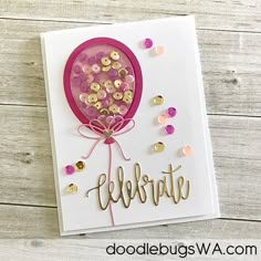 a handmade birthday card with confetti and balloons