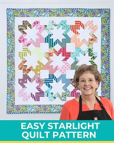 a woman standing in front of a quilt with the words easy starlight quilt pattern on it