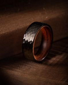 a wooden ring sitting on top of a table