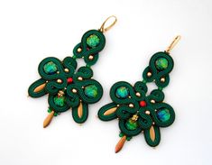 Big green earrings, green and gold earrings, chandelier earrings Large green and gold soutache earrings with a touch of red :) Choose the hooks you like:) Length without hook (approx.): 9cm. (about 3,54 inches). Important: in reality colors may be slightly different, depending on the display unit you are using :) I ship worldwide through registered Air-mail. It's important that Your item arrives safely. Green and gold earrings will be shipped in 3-5 business days. If You have any questions, plea Handmade Green Chandelier Earrings For Party, Handmade Green Earrings For Party, Green And Gold Earrings, Hand Embroidered Jewelry, Soutache Bracelet, Soutache Necklace, Emerald Green Earrings, Brown Earrings, Earrings Chandelier