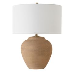 a light brown vase with a white shade on the base and a white lampshade