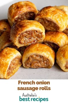 sausage rolls are piled on top of each other with the words french onion sausage rolls best recipes