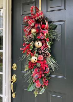 a christmas wreath hanging on the front door