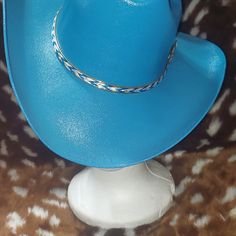 You Are Looking At An Alamo Hat Company Cowboy Hat. It Is Blue With A Blue And White Hat Band With A Gold Trim. The Hat Is Old Stock But New And Unused. Blue Western Straw Hat With Curved Brim, Blue Brimmed Straw Hat For Rodeo, Blue Curved Brim Sun Hat For Rodeo, Western Blue Straw Hat For Summer, Wide Brim Blue Sun Hat For Rodeo, Blue Western Straw Hat For Summer, Western Blue Wide Brim Sun Hat, Western Style Blue Straw Hat For Summer, Casual Blue Fedora With Wide Brim