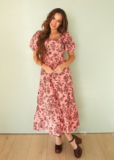 A DM design that was created after our best selling Josie dress, but with a fun fall floral print for Fall! This design minimizes and flatters any body shape! As always, a modest square neckline, a smocked back, soft cotton floral fabric, bubble sleeve, tiered skirt, bodice darts, and an extremely comfortable fit! If you love our Josie, then you will LOVE our Cassidy! Product Fit + Details: Tiered skirt Puff sleeves Modest Square-Neckline Elastic back Full skirt & tiered skirt Fully lined Forgiv Modest Floral Print Dress With Square Neck, Modest Square Neck Dresses With Floral Print, Non-stretch Floral Print Maxi Dress With Short Sleeves, Non-stretch Short Sleeve Maxi Dress With Floral Print, Bodice Darts, Rose Floral Dress, Modest V-neck Floral Print Dress, Pink Floral Print Dresses With 3/4 Sleeve, Pink Floral Print A-line Maxi Dress