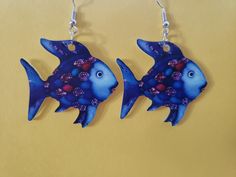 Do you remember the story about Rainbow Fish?  Look no futher here this fish looks similar to it! These super light weight earrings are so cute!  These earrings will bring back fond childhood memories to all! They are definatly a conversation starter! Definately a unique gift and great for a teacher too! About Rainbow, Fish Earrings, Rainbow Fish, Blue Fish, Do You Remember, Light Weight Earrings, Bring Back, Childhood Memories, Jewelry Earrings Dangle