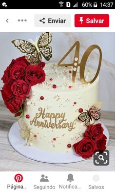 a white cake with red roses and butterflies on top is shown in the instagramr