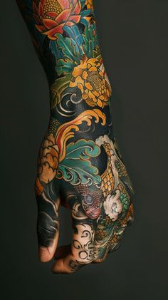 Colorful traditional arm tattoo design with floral motifs and mythical creatures on dark background Highly Detailed Tattoo, Spanish Art Tattoo, Japanese Traditional Back Piece, Full Color Sleeve Tattoos Women, Japanese Tattoos Traditional, Big Forearm Tattoo, Color Hand Tattoos, German Tattoo For Men, Japanese Traditional Tattoo Sleeve