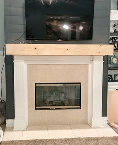 a fireplace with a flat screen tv above it