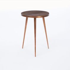 a small wooden table with two legs and a round top, on a white background