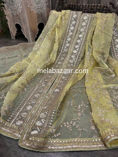 Dress up any outfit with this gorgeous organza embroidered dupatta with a heavy sequins border. Pista Green Raw Silk Dupatta With Mirror Work, Pista Green Unstitched Organza Suit, Pista Green Dupatta With Mirror Work For Festive Occasions, Festive Pista Green Dupatta With Mirror Work, Diwali Pista Green Dupatta With Mirror Work, Pista Green Organza Unstitched Suit With Resham Embroidery, Pista Green Organza Unstitched Suit With Dabka Work, Festival Organza Sharara With Dabka Work, Pista Green Organza Anarkali Set With Dabka Work