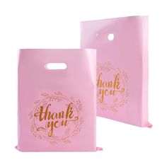 two pink bags with the words thank you and gold foil lettering on each one side