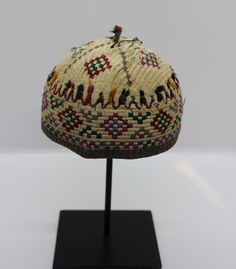 "*Diameter: 4.5\", Height: 3\" *1930-1960's handmade embroidered hat from Uzbekistan, Turkmenistan *Made of organic cotton, wool, goat hair, colors are a combination of synthetic and natural dyes *Dry clean only *Stand not included *LoomLoreGallery ID: CAC 13.2" Traditional Curved Brim Festival Hats And Headpieces, Traditional Beach Cap, Traditional Handmade Brimmed Hat, Handmade Traditional Brimmed Hat, Traditional Embroidered Hats For Ceremonial Use, Handmade Vintage Cap Style Hat, Vintage Mini Hats With Curved Brim For Festivals, Vintage Costume Cap For Festival, Handmade Vintage Cap Hats