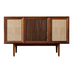 an old fashioned wooden cabinet with two doors and three panels on the front, against a white background