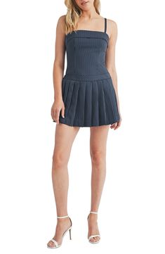 A sharply pleated skirt overlay adds to the preppy charm of this leggy romper covered in polished pinstripes. 25 1/2" center front length; 1" inseam; 26" leg opening (size Medium) Hidden side-zip closure Square neck Adjustable straps Lined 91% polyester, 9% rayon Hand wash, line dry Imported Chic Fitted Striped Skort, Chic Striped Fitted Skort, Fitted Striped Skort With Pleated Skirt, Chic Striped Skort For Spring, Casual Pleated Tennis Dress For Summer, Casual Pleated Sleeveless Tennis Dress, Fitted Skort With Accordion Pleats In Short Length, Spring Pleated Short Tennis Dress, Fitted Pleated Tennis Skirt For Spring