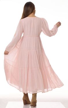 Mylene Embroidered Maxi Dress Long Sleeves Peach This stunning Mylene Embroidered Maxi Dress is the perfect addition to any wardrobe. Made from 100% Indian cotton, this dress is not only stylish but also comfortable to wear. The intricate embroidery adds a touch of elegance to the overall design. The dress comes in two sizes: Small/Medium which fits sizes 2 to 6, and Medium/Large which fits sizes 6 to 10. The long sleeves provide coverage and warmth, making it suitable for any season. The beauti Feminine Embroidered Midi Dress, Embroidered Feminine Midi Dress, Floral Embroidered Midi Dress For Daywear, Floral Embroidery Midi Dress For Daywear, Chikankari Embroidery Midi Dress, Feminine Boho Maxi Dress, Feminine Flowy Maxi Dress With Floral Embroidery, Flowy Feminine Floral Embroidered Maxi Dress, Flowy Feminine Maxi Dress With Floral Embroidery