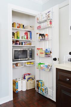 the pantry is stocked with various foods and condiments