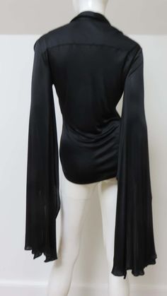 For Sale on 1stDibs - A fabulous black fine stretch silk shirt, top, blouse from Tom Ford for Gucci. It is semi fitted with a shirt collar, black mother of pearl Gucci inscribed Tom Ford For Gucci, Plunge Blouse, Black Silk Shirt, Tom Ford Gucci, Gucci Top, Geometric Top, Corset Style Tops, Velvet Shirt, Angel Sleeve