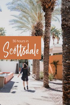 a woman walking down a street with palm trees in the background and an orange sign that says, 365 hours in scottsdale