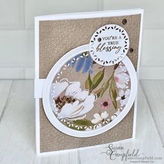 a close up of a card with flowers on it