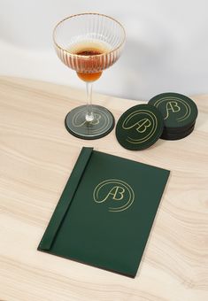 two coasters and a drink on a table