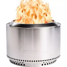 a stainless steel stove with flames coming out of it's top and bottom lid