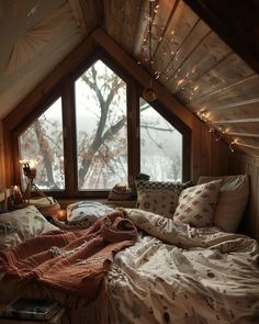 a bedroom with a large window and lots of lights on the ceiling is decorated in warm colors