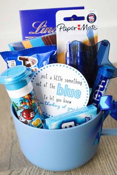 a blue bucket filled with lots of different items