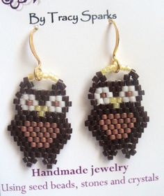 a pair of earrings made out of seed beads