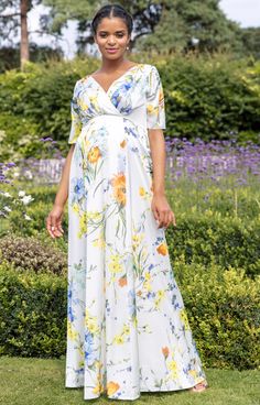 A modern style with a fresh bright print, our Zoey Maternity Gown is the perfect dress for all of those special invitations. Designed in lightweight soft sheen satin that glides over your pregnancy curves to create the most elegant silhouette. Featuring a flattering cross-over neckline front and back with a concealed zip at the centre back of the gown this dress will give you confidence and comfort all in one. Maternity Wedding Guest, Maternity Wedding Guest Dress, Gown For Pregnant Women, Rose Tiffany, Maternity Occasion Dress, Maternity Wedding Dresses, Gown Floral, Maternity Wedding, Tiffany Rose