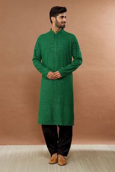 Festive green kurta with sequin embroidery and mandarin collar. Paired with black patiala.
Component: 2
Pattern: Embroidered
Type Of Work: Sequin
Neckline: Mandarin
Sleeve Type: Full
Fabric: Cotton
Color: Green
Other Details: 
Sequin work
Occasion: Mehendi and Puja - Aza Fashions Sequin Embroidery, Sequins Embroidery, Green Cotton, Mandarin Collar, Aza Fashion, Fabric Cotton, Sleeve Type, Types Of Sleeves, Sequin