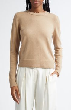 Ultrasoft cashmere yarns give luxurious softness to this classic sweater with ribbed trim. 22" length (size Medium) Crewneck Long sleeves 100% cashmere Dry clean or hand wash, dry flat Imported Classic Beige Cashmere Tops, Beige Fine Knit Cashmere Sweater, Fine Knit Beige Cashmere Sweater, Beige Cashmere Top With Ribbed Collar, Beige Cashmere Tops With Ribbed Collar, Classic Cashmere Sweater In Neutral Color, Classic Brown Cashmere Top, Classic Neutral Crew Neck Sweater, Cashmere Yarn