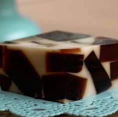 a brown and white soap bar sitting on top of a blue doily