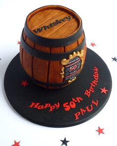 a birthday cake made to look like a wooden barrel with the number 50 on it